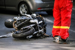 motorcycle on the road next to a first responder